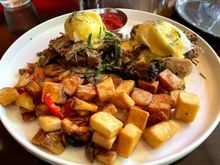 Philly Special - roast pork, poached eggs, braised greens, english muffin, hollandaise, breakfast potatoes