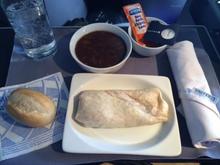 UA IAD-IAH "dinner" -- 2014 May 07
A "wrap" with french onion soup and a bread roll. No salad nor anything else to liven things up. Sad how cheap and pathetic UA has become lately.