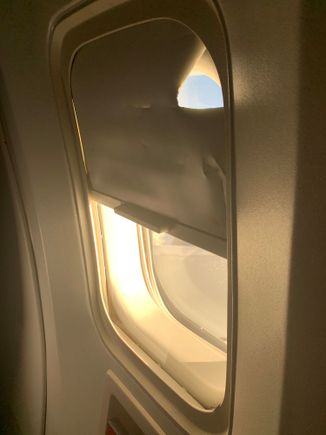 Busted window shade on an old 767 on DL. Didn’t really get the job done