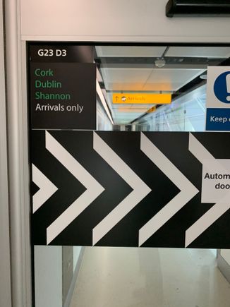Door with a sign reading “Cork Dublin Shannon Arrivals only”