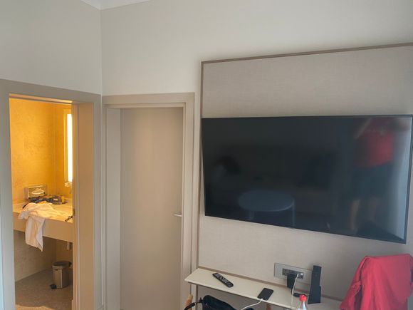 The junior suite had two swiveling TVs