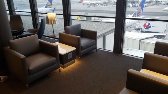 I would enjoy sitting in this area of the lounge watching planes all day.