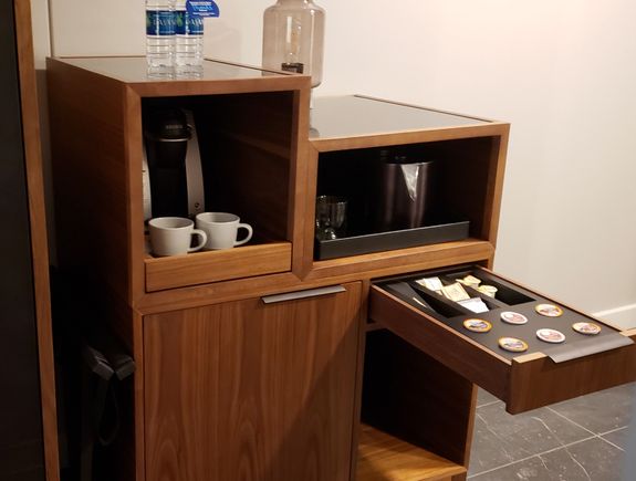 Refrigerator below, Keurig above, supplies in drawer, ice bucket and glasses, and that thing on top that looked at first like some sort of wierd dispenser? It's a lamp, a really funky retro number!