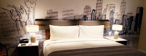 Behold: the bed! AC and usb on each side. In addition to bedside lamps, there are overhead (ceiling) lights, switches on each side controlling its half.