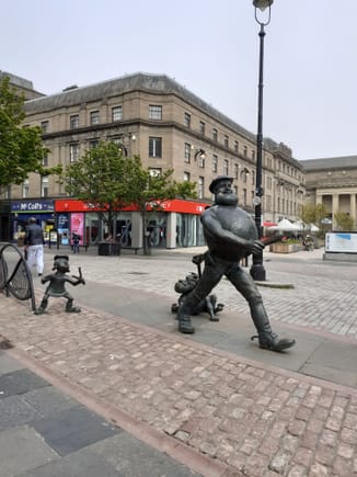 Desperate Dan statue ( could do with a bit of a clean) Caird hall to the right ( being used as a Covid vaccination centre).