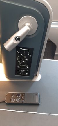 Remote stored below the headset.