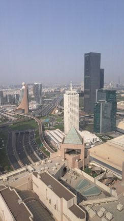 View from 4001. Dubai Frame in the distance. Fairmont hotel roof at the bottom. Bit hazy