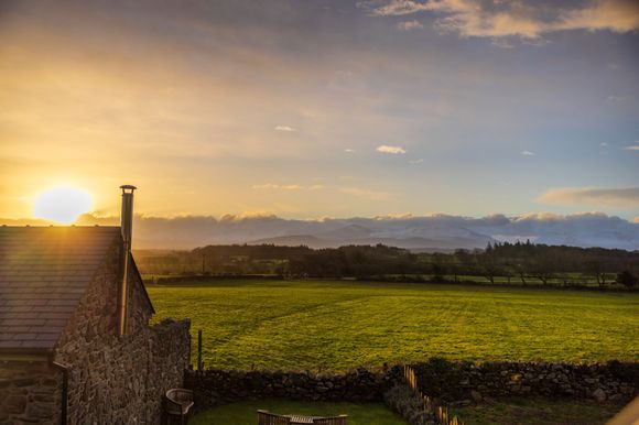 Looking back towards Snowdonia NP from Anglesey in Northern Wales from our Airbnb window earlier this week.