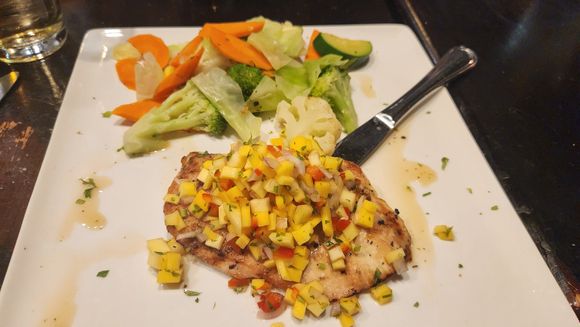 Chicken with mango salsa and seasonal vegetables