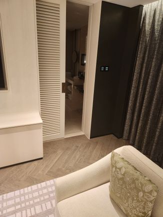Door from living area to MASTER bathroom!  Notice is slated, and there's no latch/lock.  Really weird design considering the guest bathroom