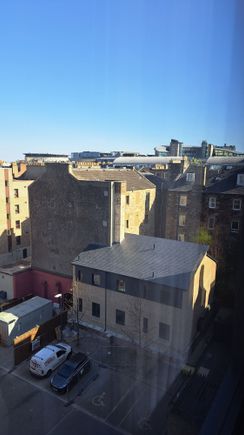 Side view from Rm 531. Top of the back of Edinburgh castle can be  just be seen jutting above the office building on the right side