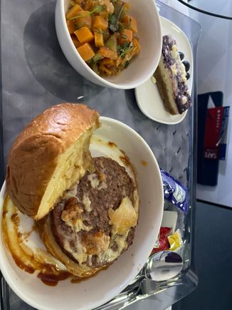MSP-SEA Lunch. Impossible burger a s tasty carrot side salad. Burger was good, bun was together enough to eat like a burger. Still like the blueberry cheesecake. 