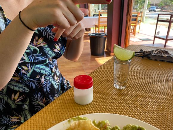 A tequila shot for the lady, on the house