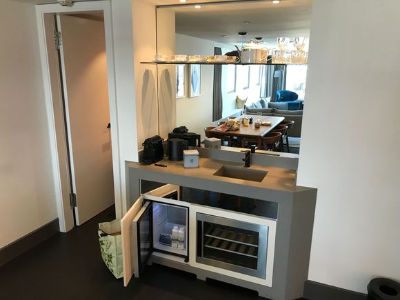 The wetbar area:
- Nespresso capsules machine
- Water cooker
- Mini fridge (2x water cartons)
- Wine fridge (empty)
* left, door to closet 