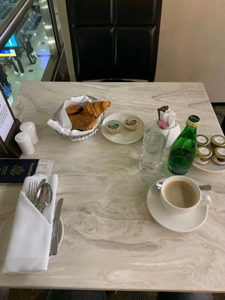 Starting with pastries, jam, butter and sparkling water. 
