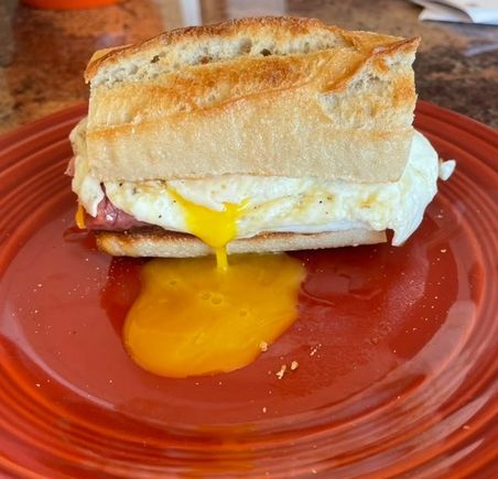 Ham, cheddar, egg and hot honey on toasted baguette. 