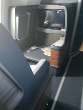 Seat 1A. Has a dedicated ottoman and increase in space.