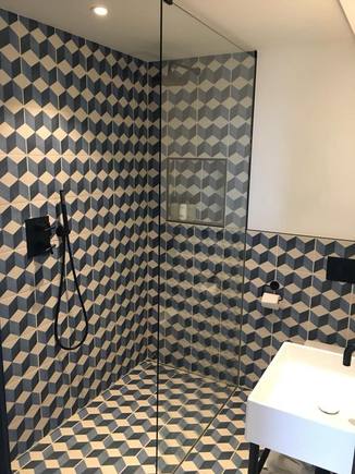 Cozy bathroom with spacious shower 
