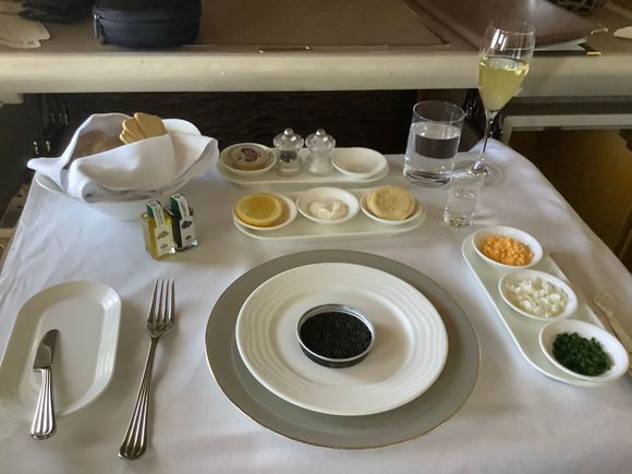 I just flew first class on Emirates from Frankfurt to Dubai. This was my caviar portion of my dinner. Now…I’m not saying United should try to live up to Emirates standards.  I paid a LOT more for the Emirates ticket than a comparable United Polaris class ticket. And I actually think the Polaris food tastes fine. But I think it is WELL past time for United to stop pretending it’s foil covered meals and plastic drink cups have anything to do with limiting the spread of COVID. That’s a lie. 