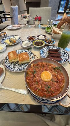 The warm dishes of the Turkish breakfast. Meneman, sujuk, and a cheese pastry
