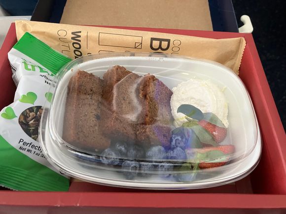Another delicious meal on a 5 hour JFK-AUA flight.  

Thank goodness  there’s a plastic cover on the plate so that you can save it for later too — the meal is way too large  to consume in one sitting.    Who can eat 1 piece of banana bread cut into 3 slices at one time???

I’m also very satisfied that the choices have not changed in 2 years.  