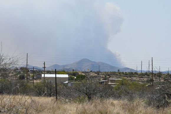 A 'small' wildfire looking westward from I-17 south between Sedona-Phoenix, Arizona US. 