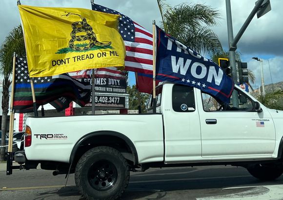 Russian flag on driver’s side partially obscured.