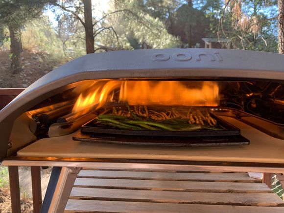 Experimenting with asparagus in the gas pizza oven. It turned out great with light charring of the tips for flavor. 