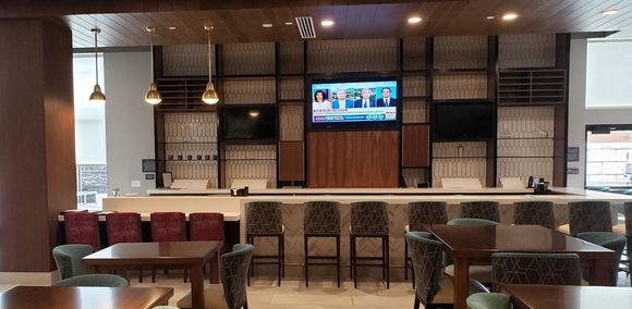 Bar and seating at tables nearby when busy