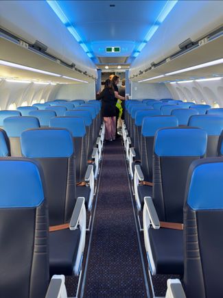 Seats are pleather and feel fairly firm