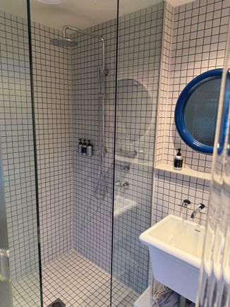 Shower and the deepest bathroom sink I have ever seen