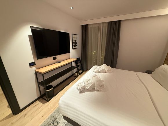 The bedroom is truly separate and has its own tv. There are plenum of outlets including USB-C and USB-A.