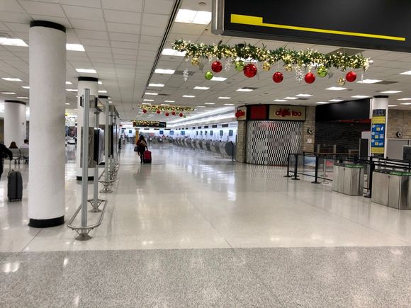 
To another deserted airport with their Holiday decorations still displayed.