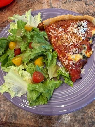 Salad and deep dish pepperoni and spinach. 