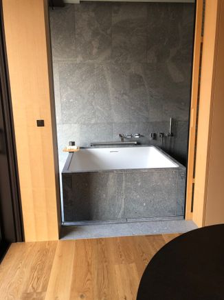 Bath as seen from living room behind sliding door