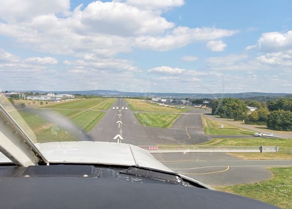 Just about to land on the runway at Koblenz-Winningen, where the airfield sits on high ground 