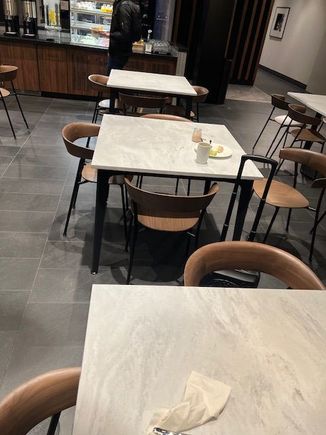 4-person tables in the dining area predominate the space.
