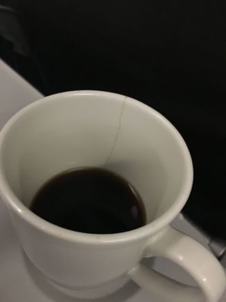 Bit of a disaster here: Didn't notice the crack in the mug until I'd drunk this much of the coffee. Inbound to Gatters from Seville. 