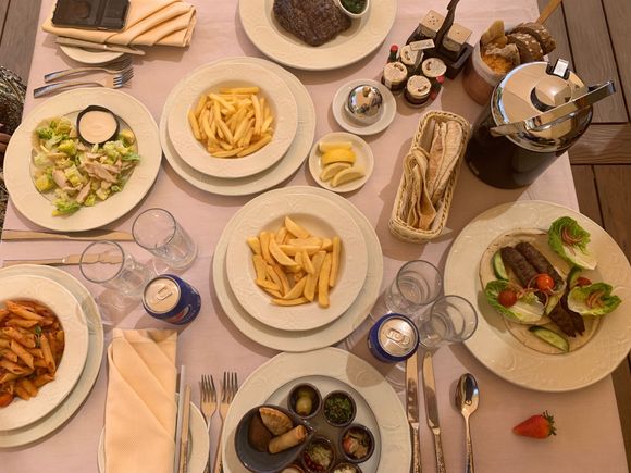 What a spread: Lamb kekab, pasta, salad, fries and medium rib-eye steak