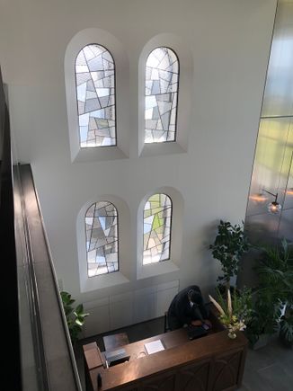Stained glass windows in lobby next to bar