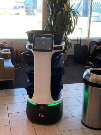 A robot doing circles,  where you could put your used plates / cutleries away