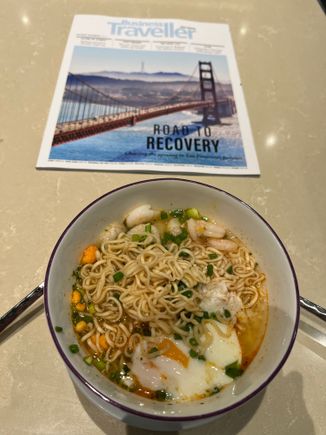 Spicy noodles with shrimp and onset egg.