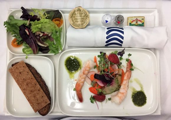 Appetizer shrimps with strawberry salad and small side salad