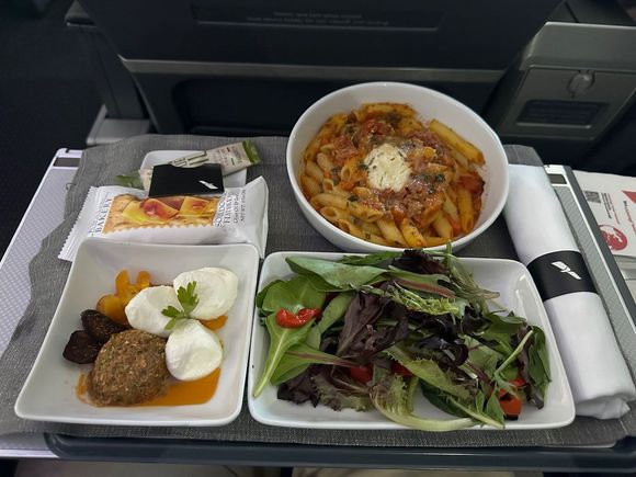 The app on the bottom left was a sundried tomato spread with mozzarella balls. It was good on its own and mixed wlll with the pasta. 