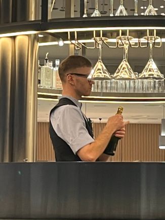 There was a long queu for service at a bar so though I will help myself for Champagne. He just shout NO and put sign ”wait for service” front of me. 