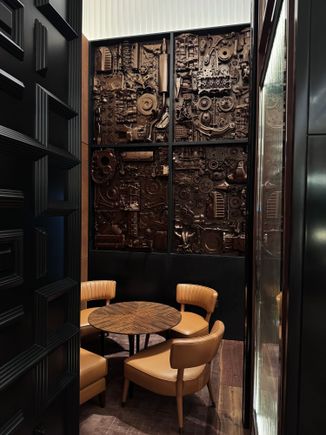 Private nook with artwork paying homage to the car factories of yesteryear. 