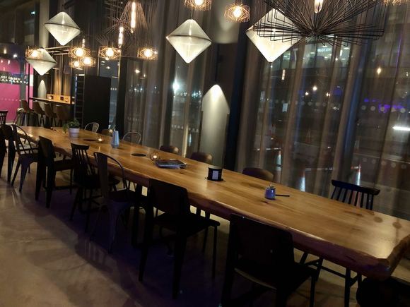 long seating area near the bar (on the left as you enter)