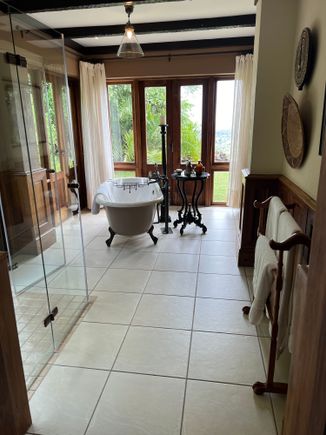 Bathroom with tub and standing shower