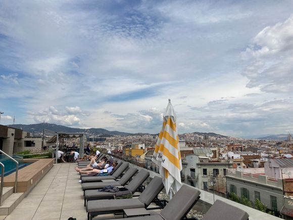 Beside it, the sunloungers : these look towards the west : look to the right to the east and you can spot the Sagrada Familia Basiliqa