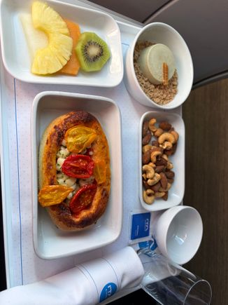 Out of FCO - no menu at all (blue sachet is sugar). Yes the center of the pizza thingy got sort of soggy. No bread offered